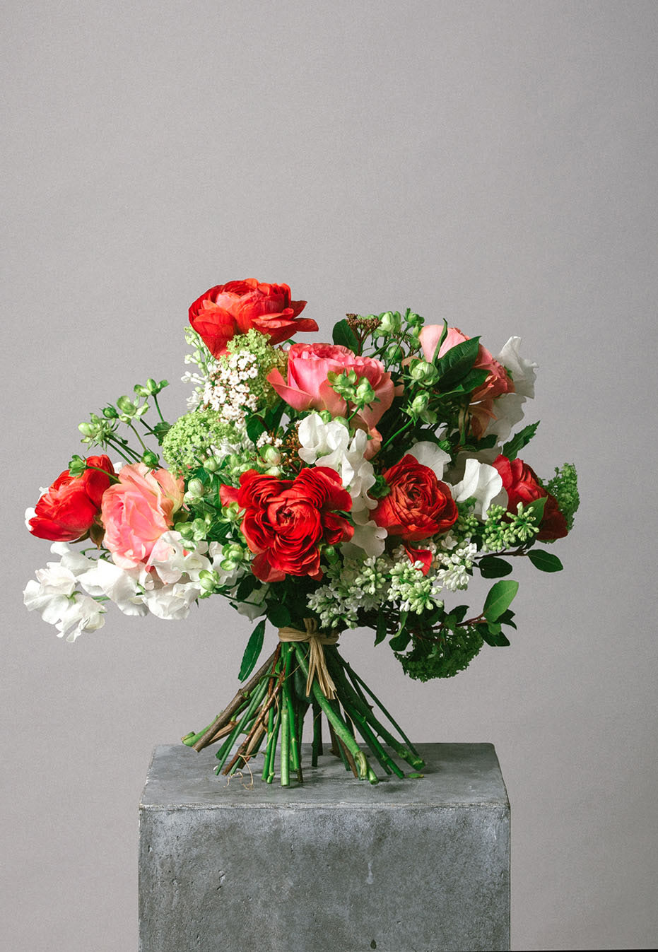 flower bouquet of ranunculus and sweet peas by flannel flowers
